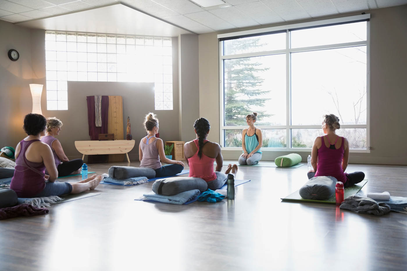 Women,In,Restorative,Yoga,Class,Studio